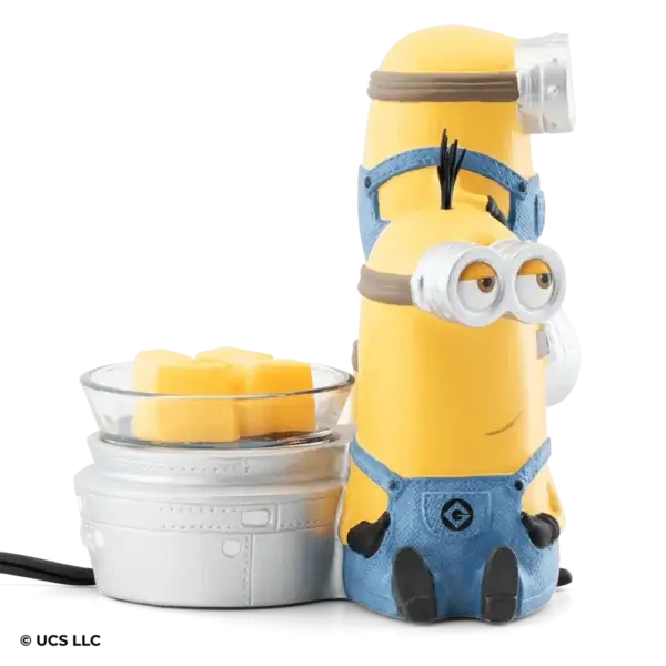 a toy figurine of a yellow cartoon character next to a bowl of cubes